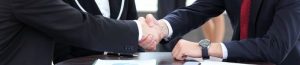Business people shaking hands, finishing up a meeting